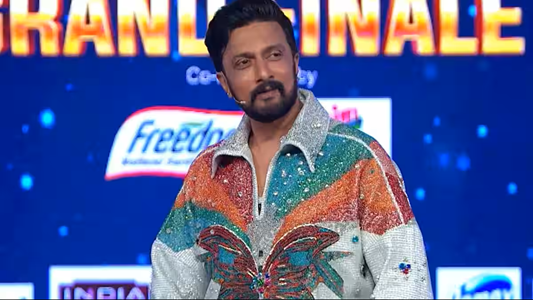 Bigg Boss Kannada 12 Grand Finale stage with host Kiccha Sudeep and winner Gilli Nata