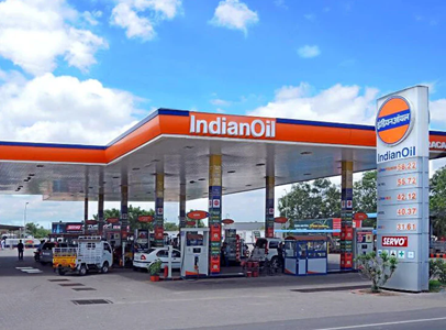 People at petrol pump in India after excise duty cut on petrol and diesel